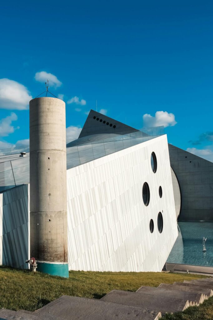 Capture of a contemporary architectural structure under a clear blue sky.