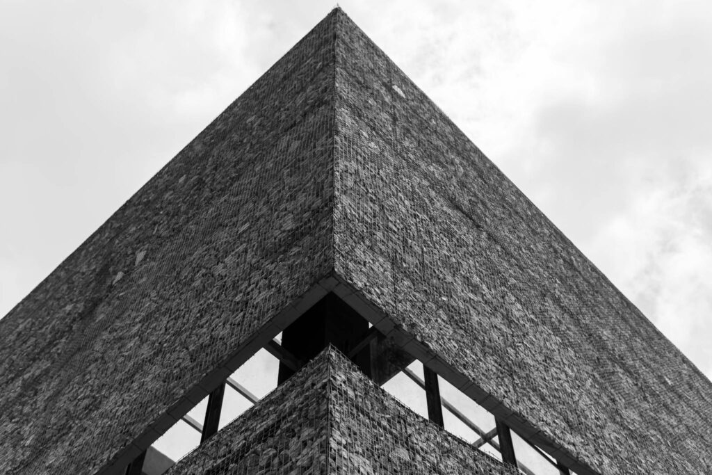 Striking minimalist architecture in grayscale with sharp contrast and clean lines.